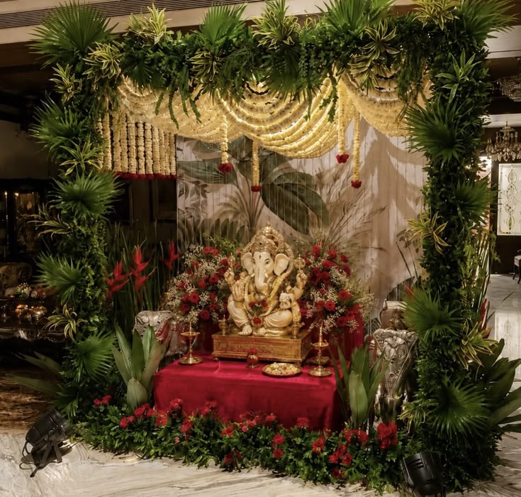SF-55 — Ganesha mantap with tropical greenery, marigold drapes and red roses