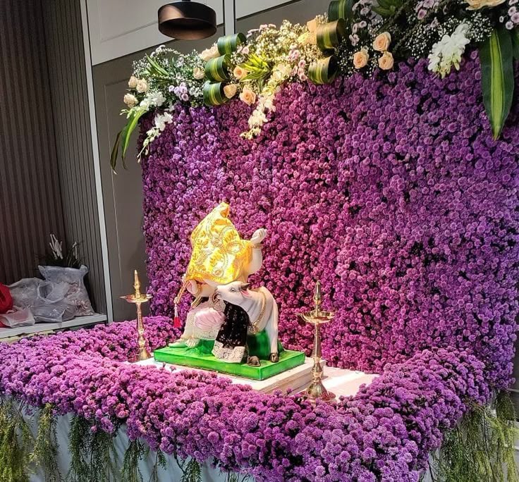 SF-02 — Gowri decoration with purple and pink flower wall and brass lamps