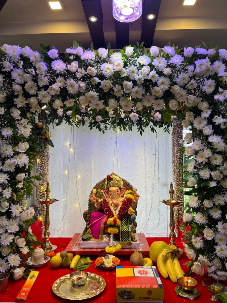 SF-32 — Grand Ganesha mantap decoration with white flower arch and hanging garlands