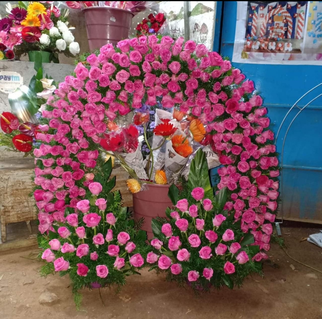 Pink rose circular floral arrangement