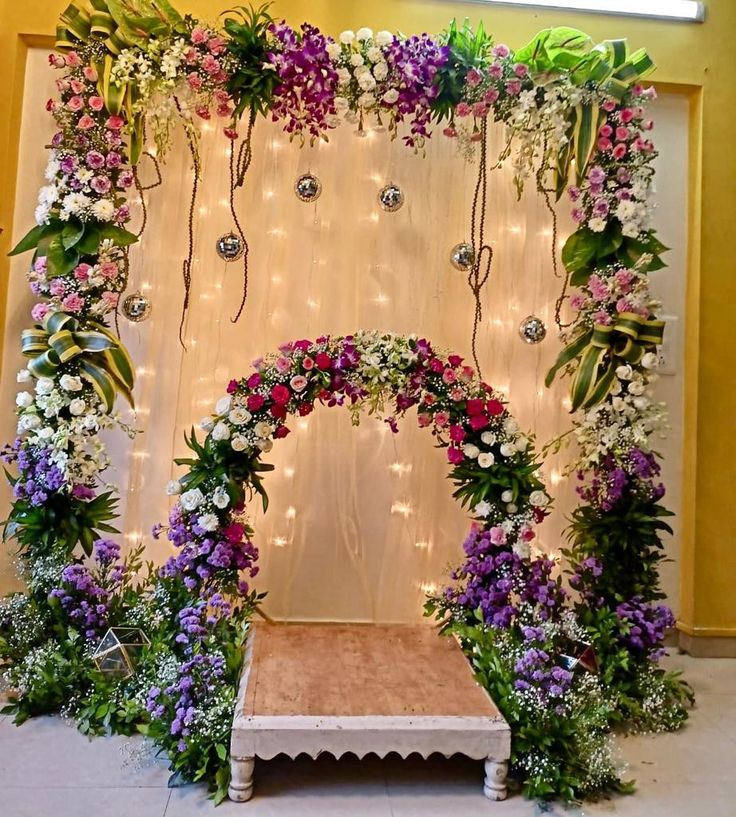 SF-66 — Double floral arch backdrop with orchids, roses and fairy lights