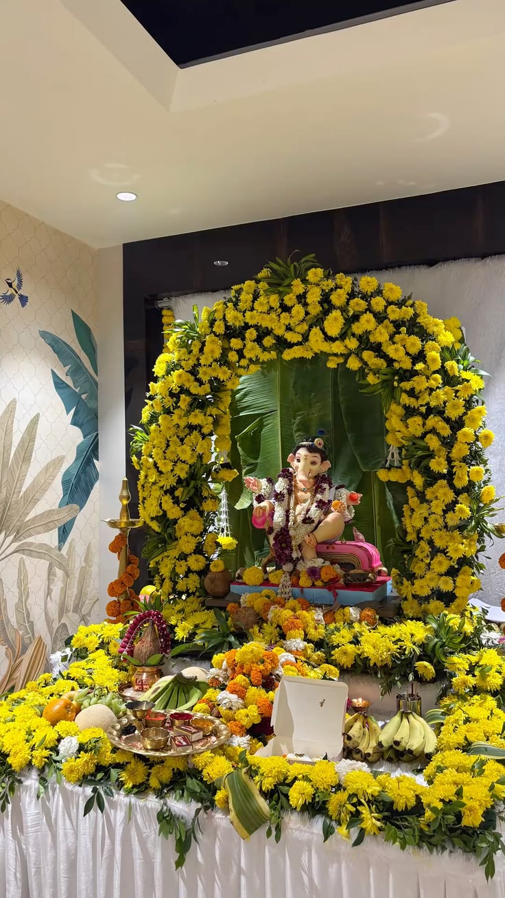 SF-42 — Ganesha decoration with yellow marigold arch and banana leaf backdrop