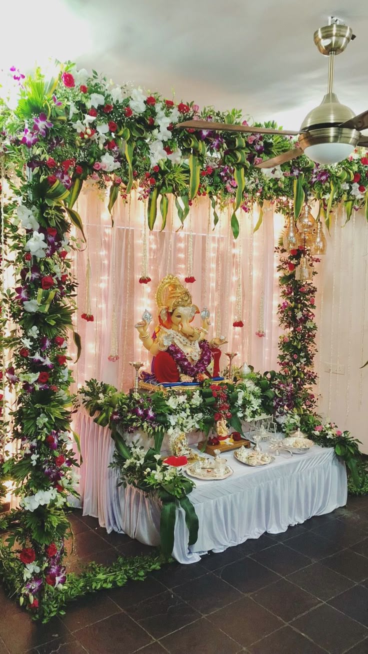 SF-65 — Ganesha mantap decoration with rose and orchid pillars, pink drape and fairy lights