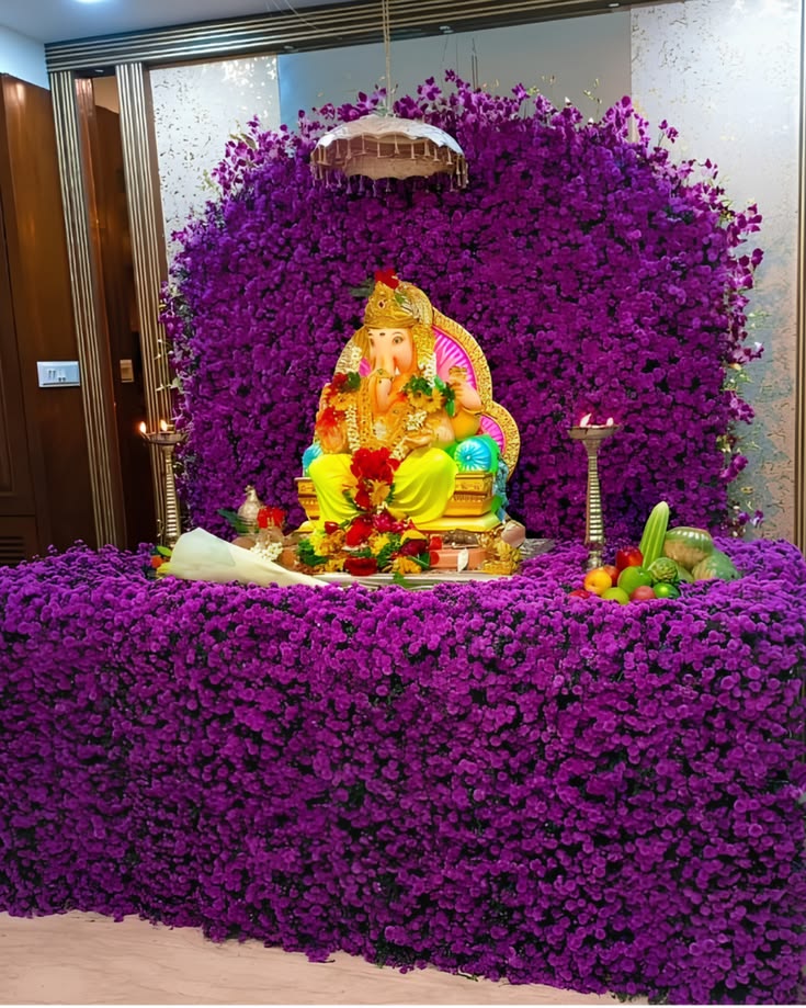 SF-01 — Ganesha idol in a full purple flower wall decoration with umbrella canopy
