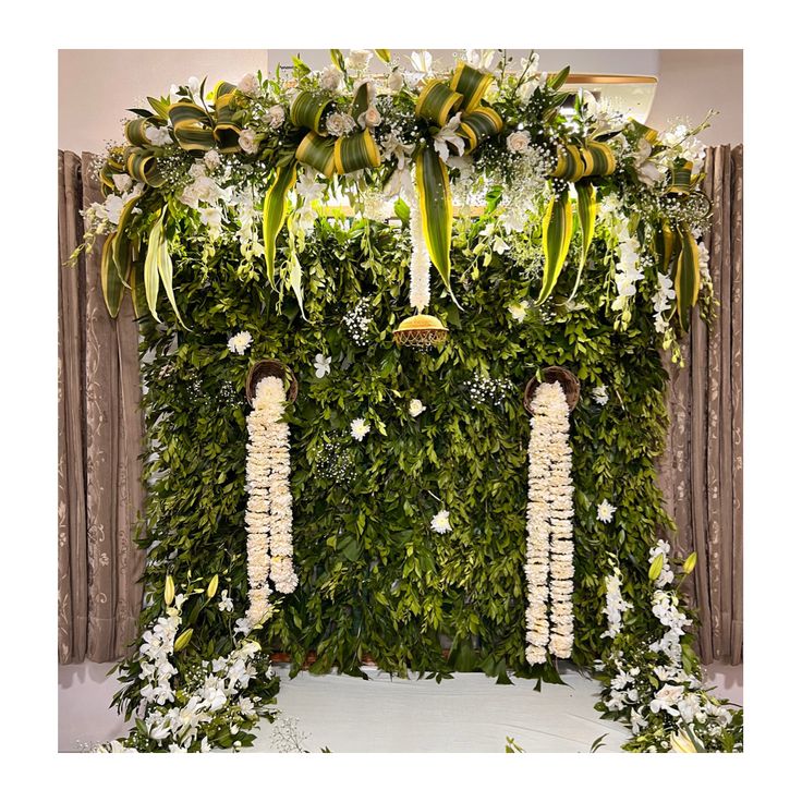 SF-57 — Green leaf wall backdrop with jasmine garlands and white orchids