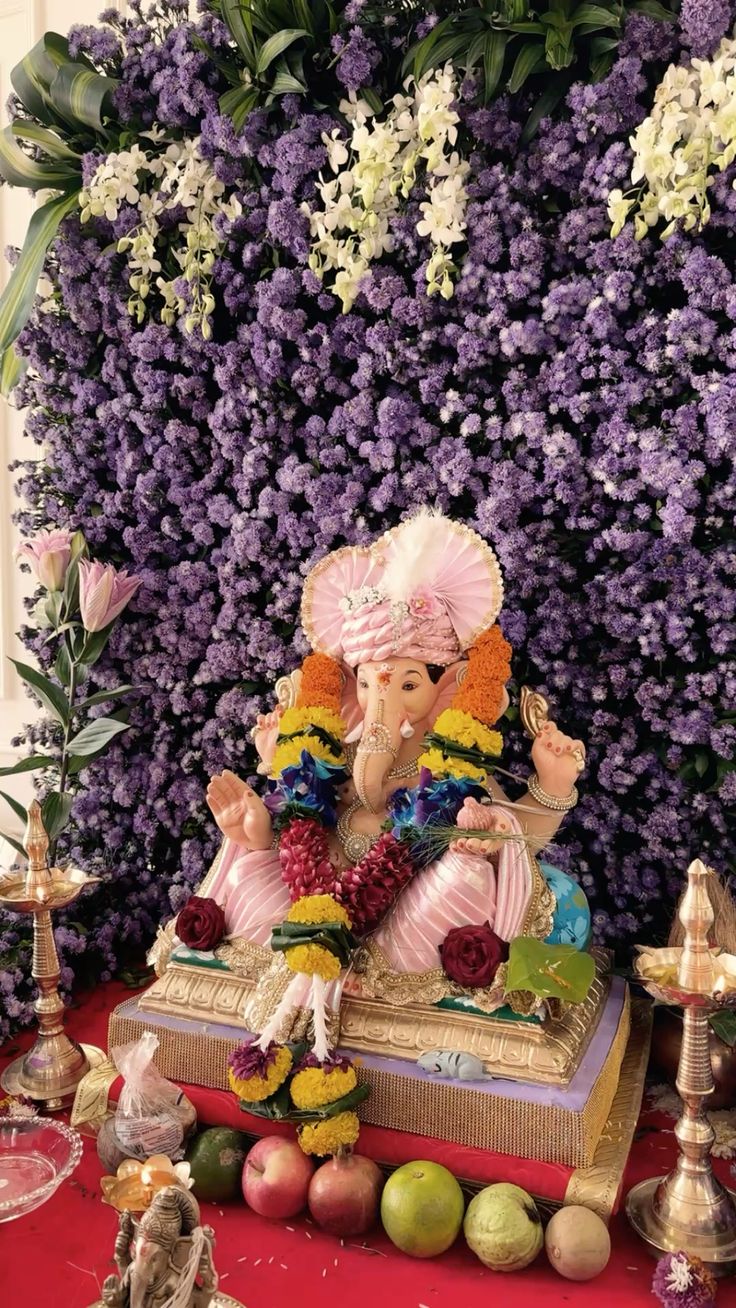SF-06 — Ganesha idol with lavender flower wall and hanging white orchids