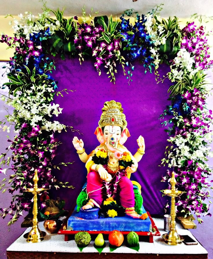 SF-61 — Ganesha decoration with purple orchid arch and brass lamps on violet backdrop