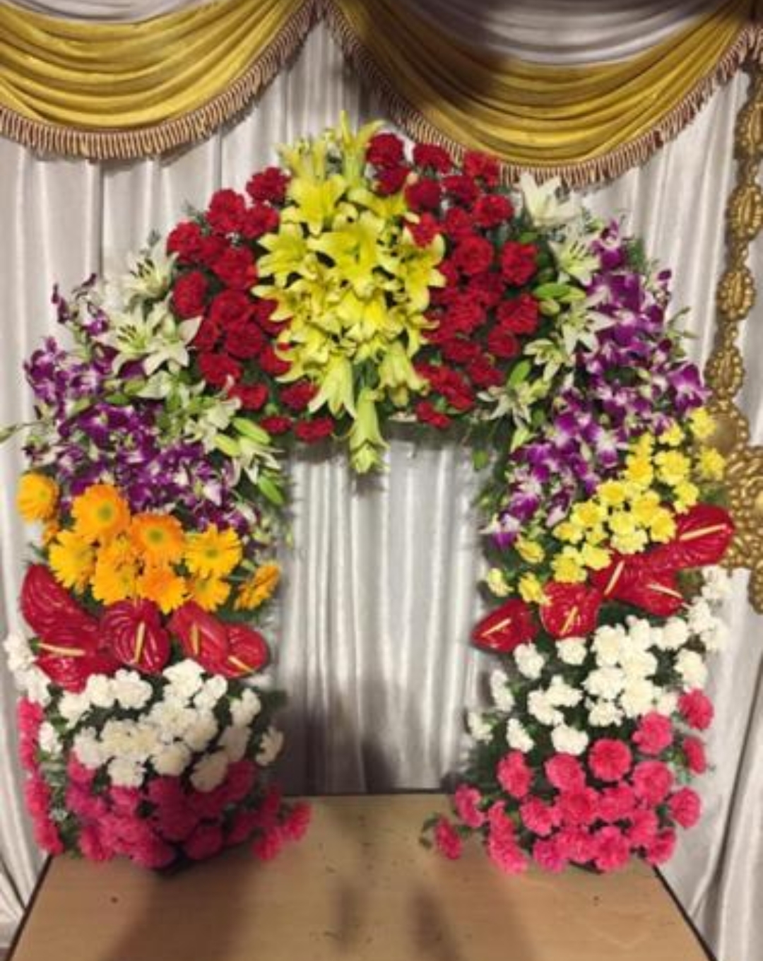 Grand floral arch with lilies, orchids and carnations