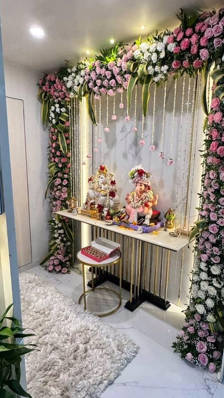 SF-64 — Gowri Ganesha pooja room decoration with pink rose arch and hanging pearl strands