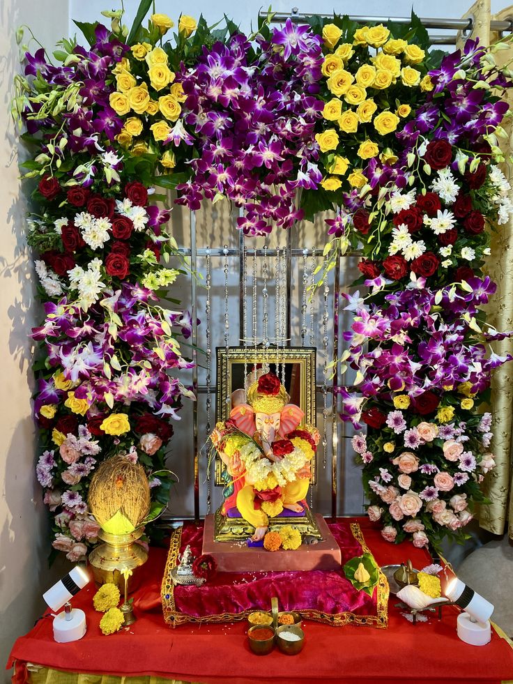 SF-43 — Ganesha mantap with purple orchid, yellow rose and red rose floral pillars