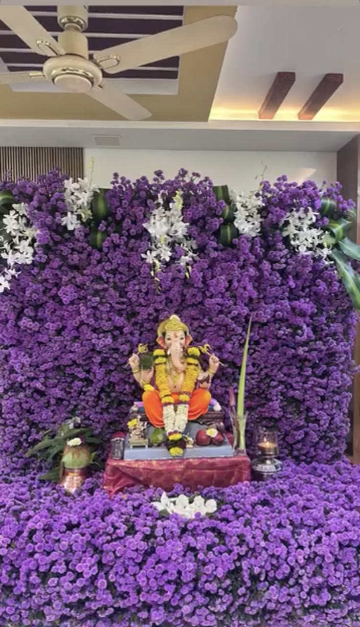 SF-03 — Ganesha decoration with purple flower wall and white orchid hangings
