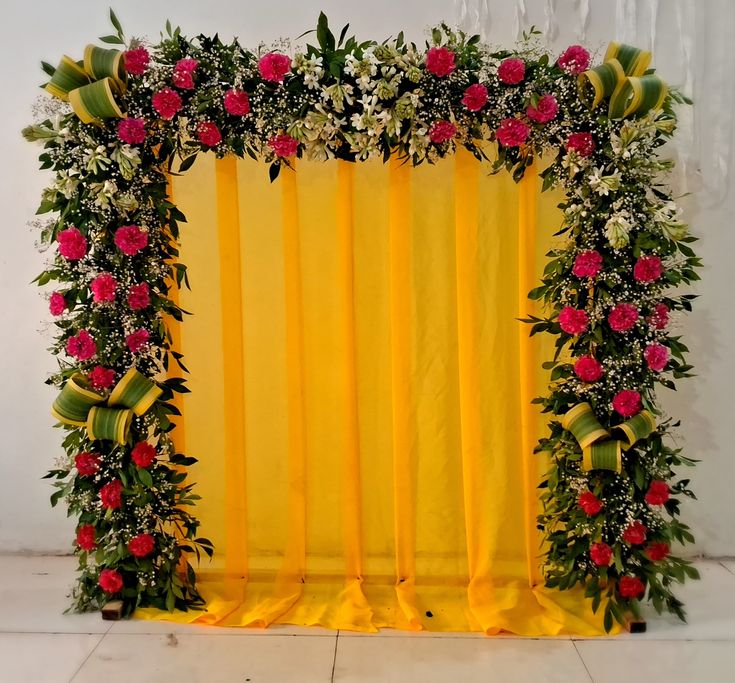 SF-67 — Yellow drape backdrop with pink carnation and greenery flower border