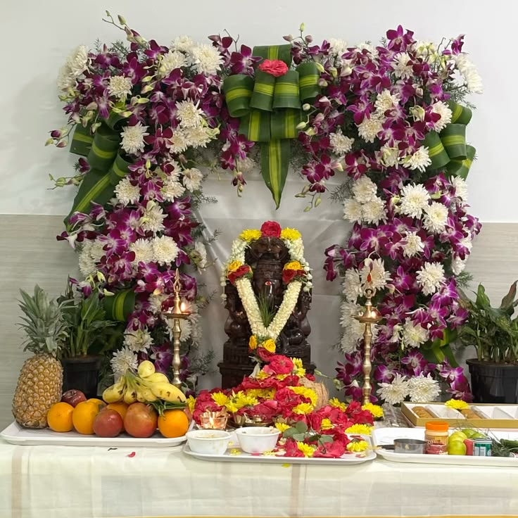 SF-60 — Ganesha pooja decoration with purple orchid arch and fruit offerings