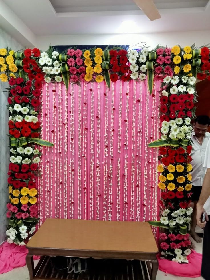 SF-69 — Pink drape backdrop with gerbera flower border and jasmine strands