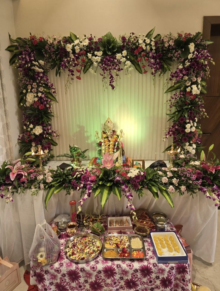 SF-63 — Ganesha pooja decoration with purple orchid square frame and lily table arrangement