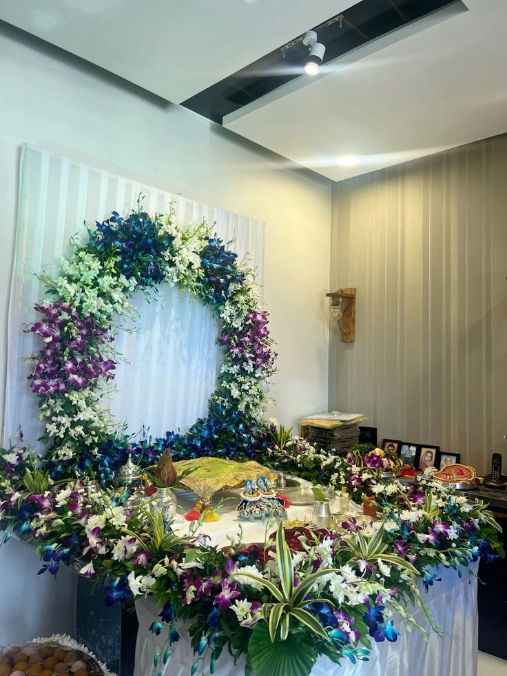 SF-40 — Pooja table decoration with blue and purple orchid ring backdrop